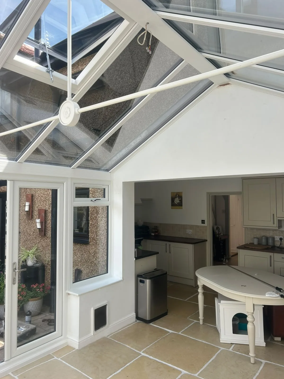 French doors closed, with the flagstone floor visible inside