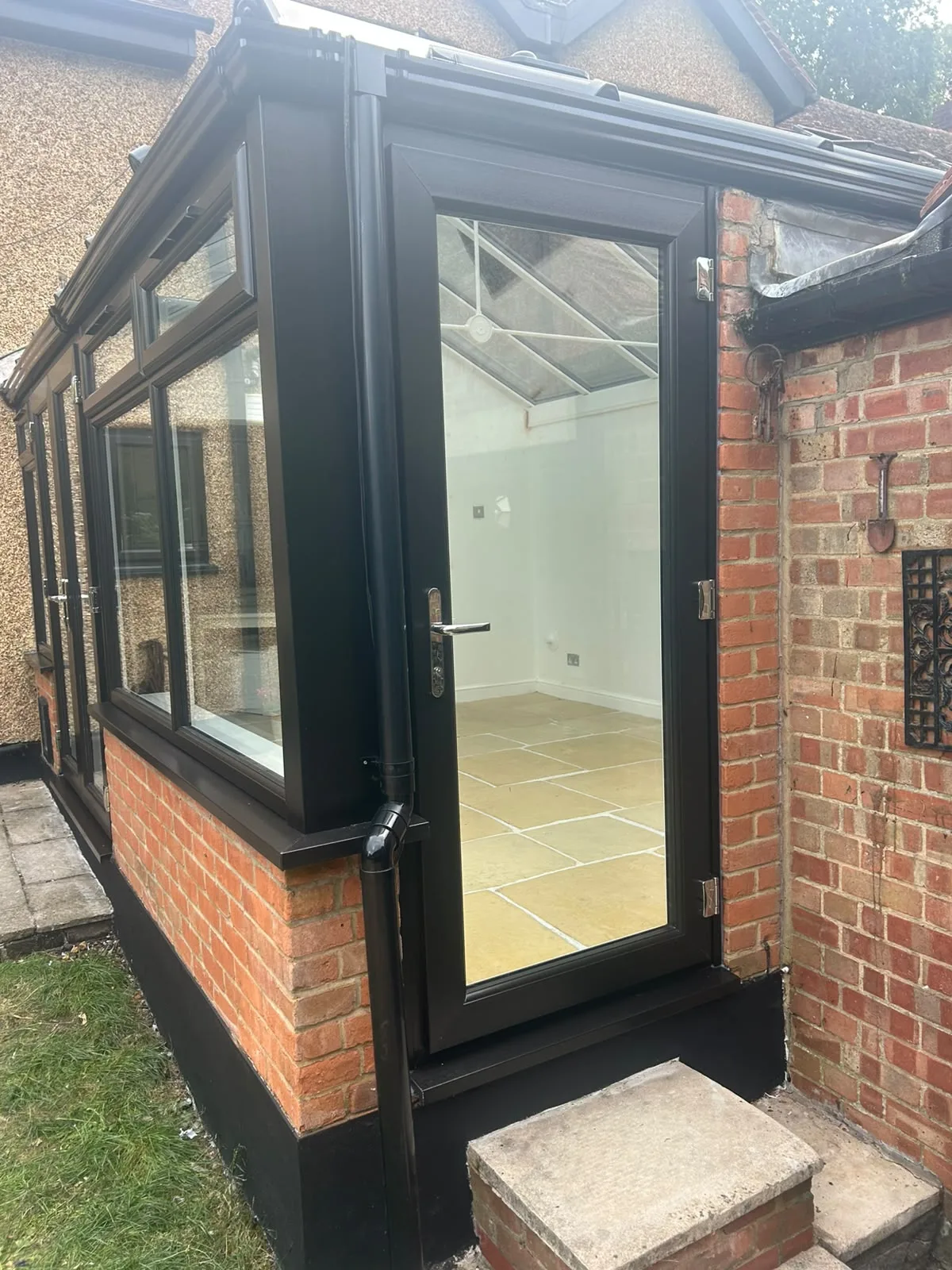 Side door standing open, showing the finished tiled interior